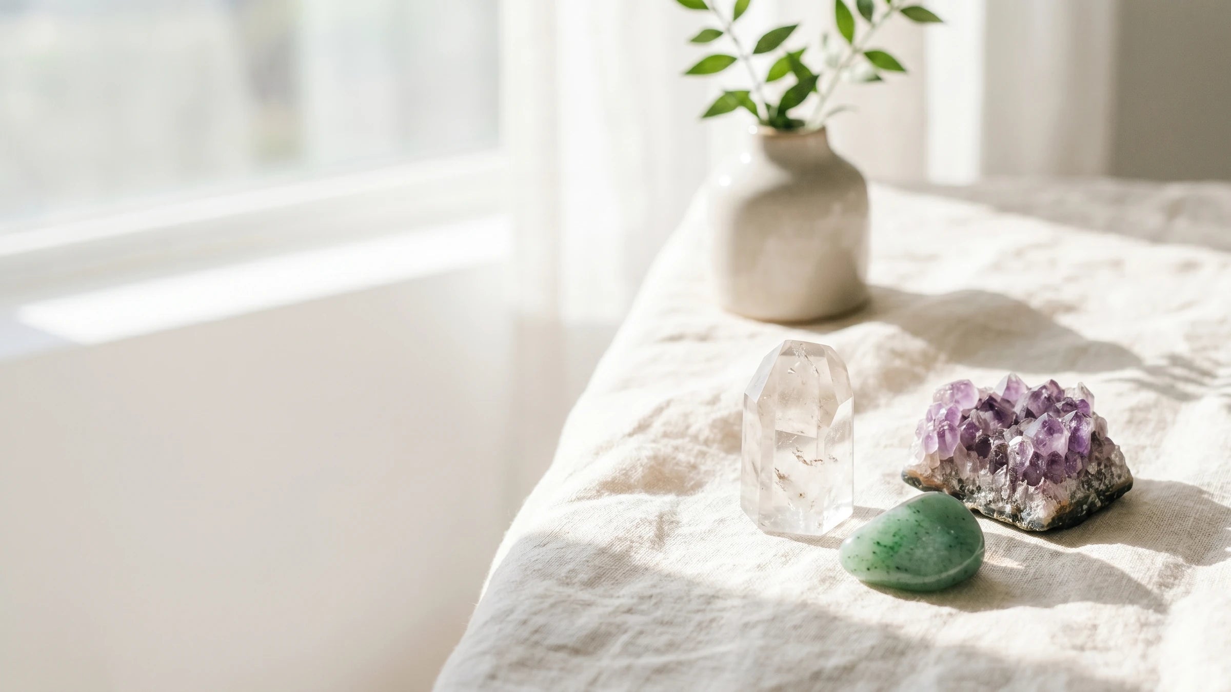 Healing crystals arranged in soft natural light.