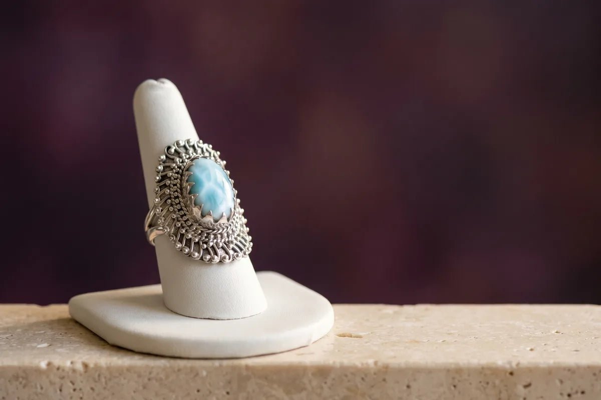 A sterling silver larimar tribal ring photographed as a luxury jewelry still life.